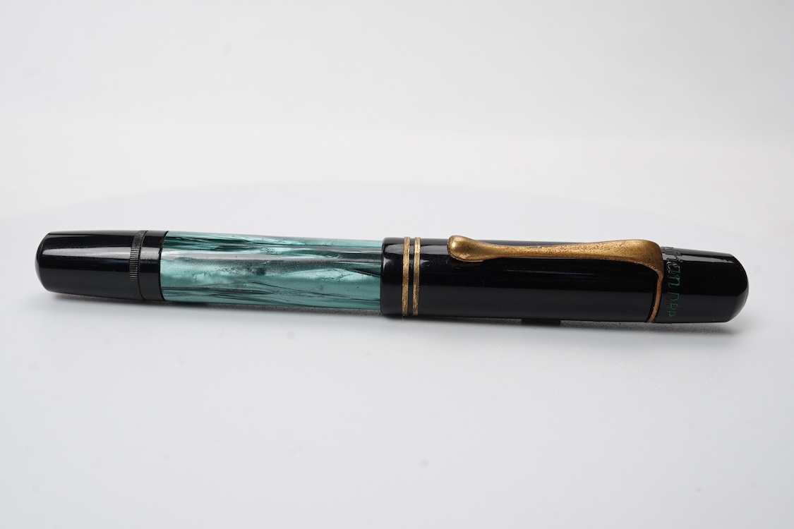 A Pelikan 100N fountain pen fitted with a 14ct. gold Pelkan nib